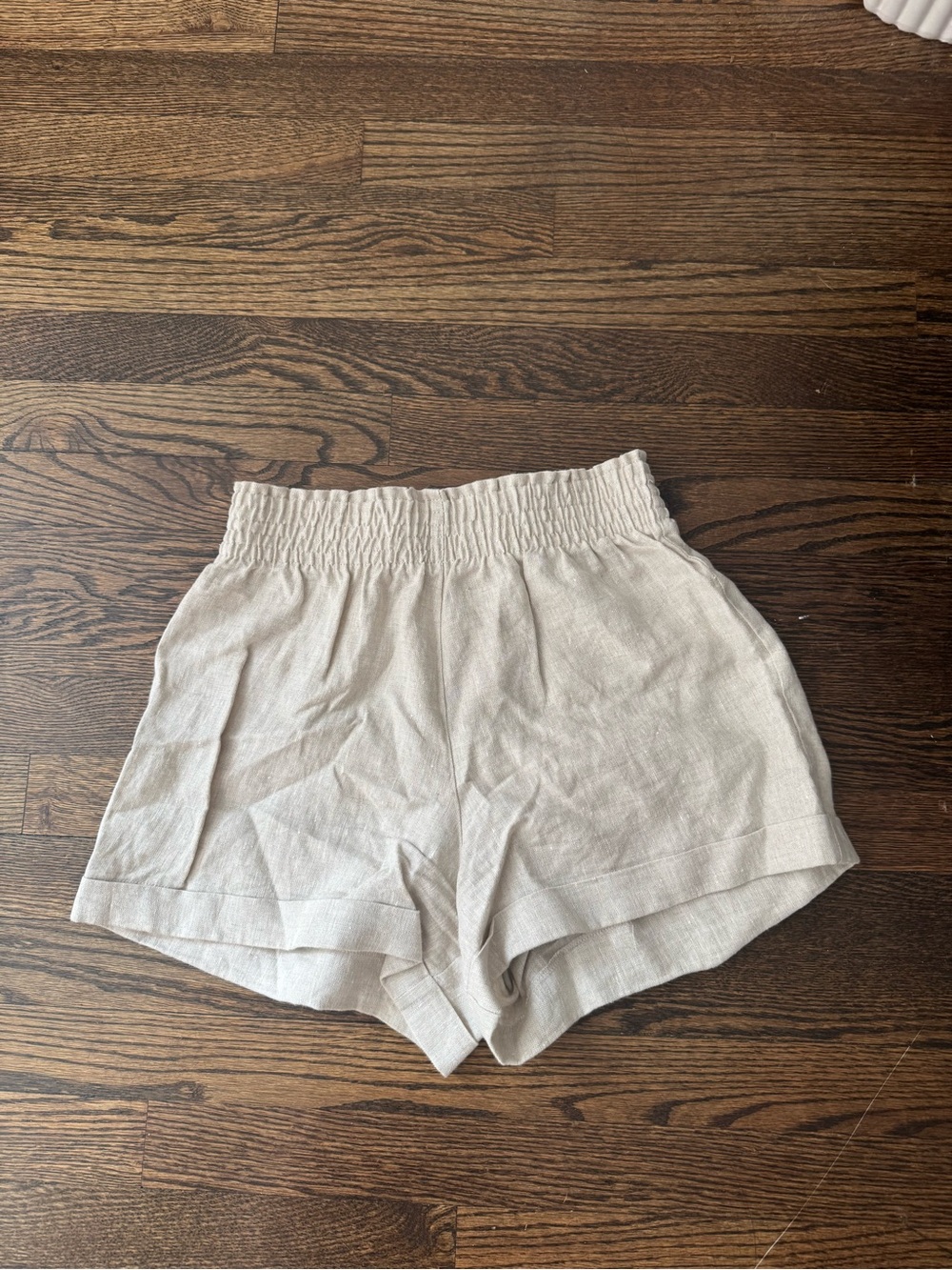 Reformation Light Beige High-Waist Smocked Shorts